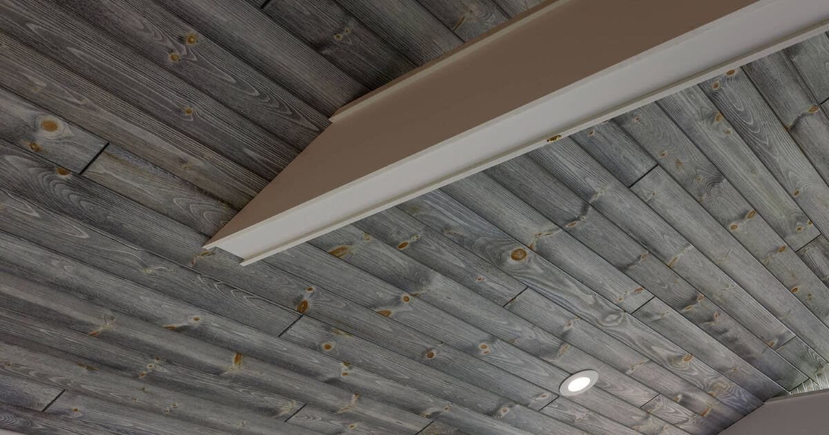 gray wood plank porch ceiling with white beams