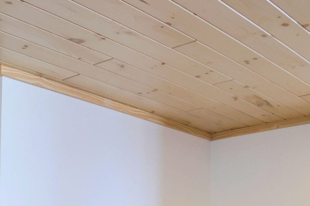 staggered light wood ceiling boards