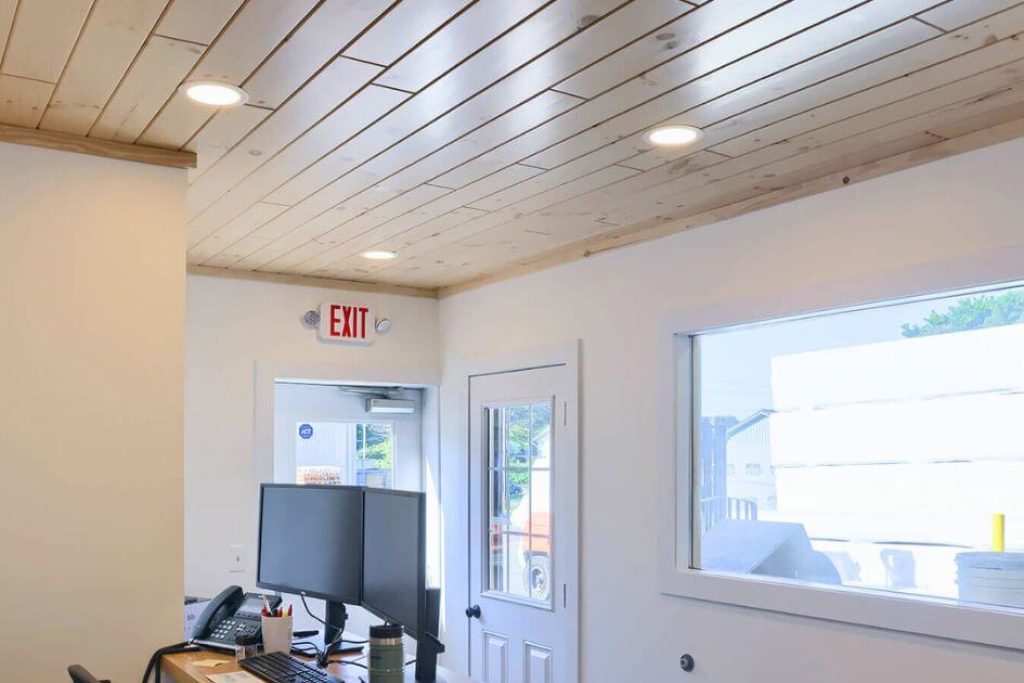 light wood stained ceiling with recess lighting in an office