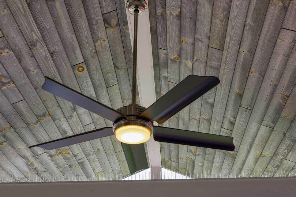 patio fan on ceiling with gray tongue and groove wood planks