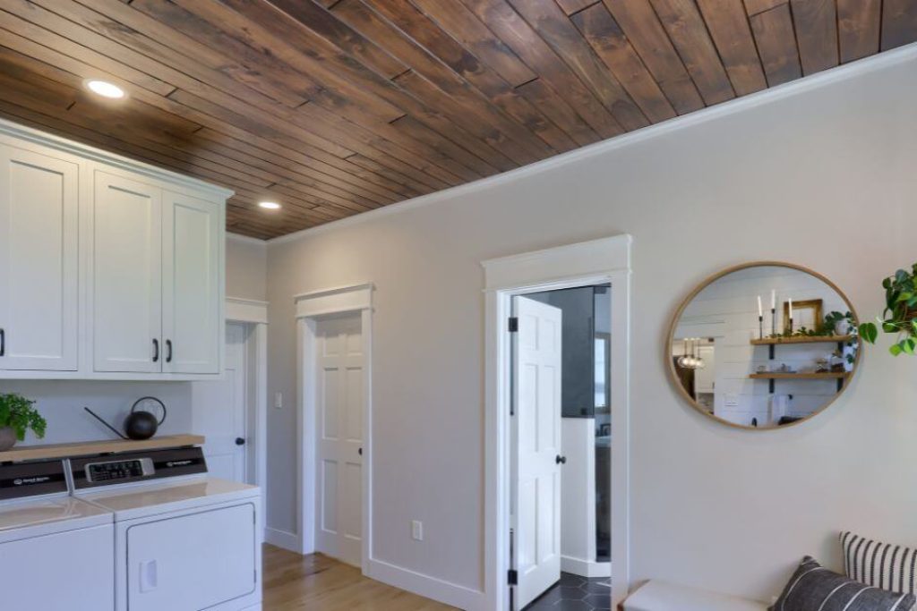 brown stained wood ceiling in laundry room