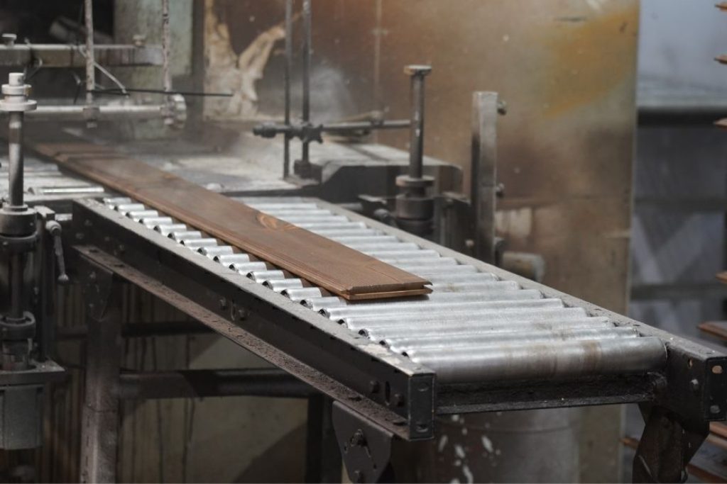 wood panel finishing machine in warehouse