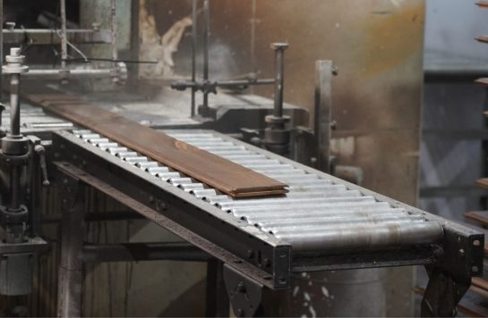 wood panel finishing machine in warehouse