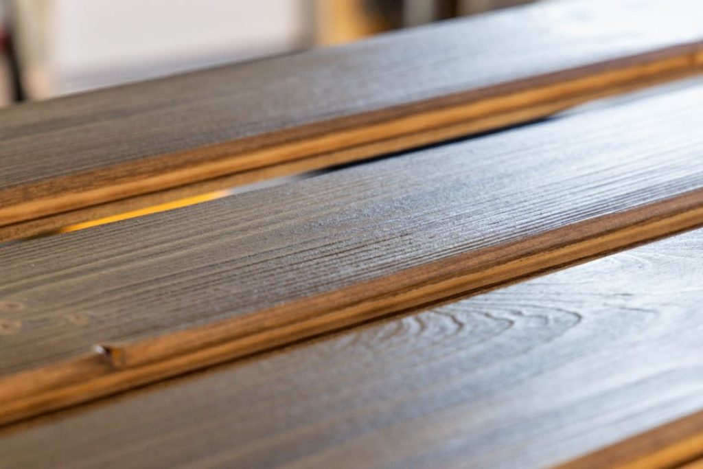 freshly stained wood panels in warehouse