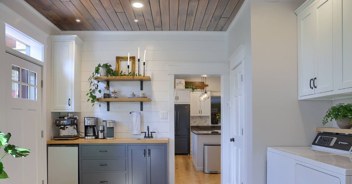 small kitchen area with dark wood paneled ceiling