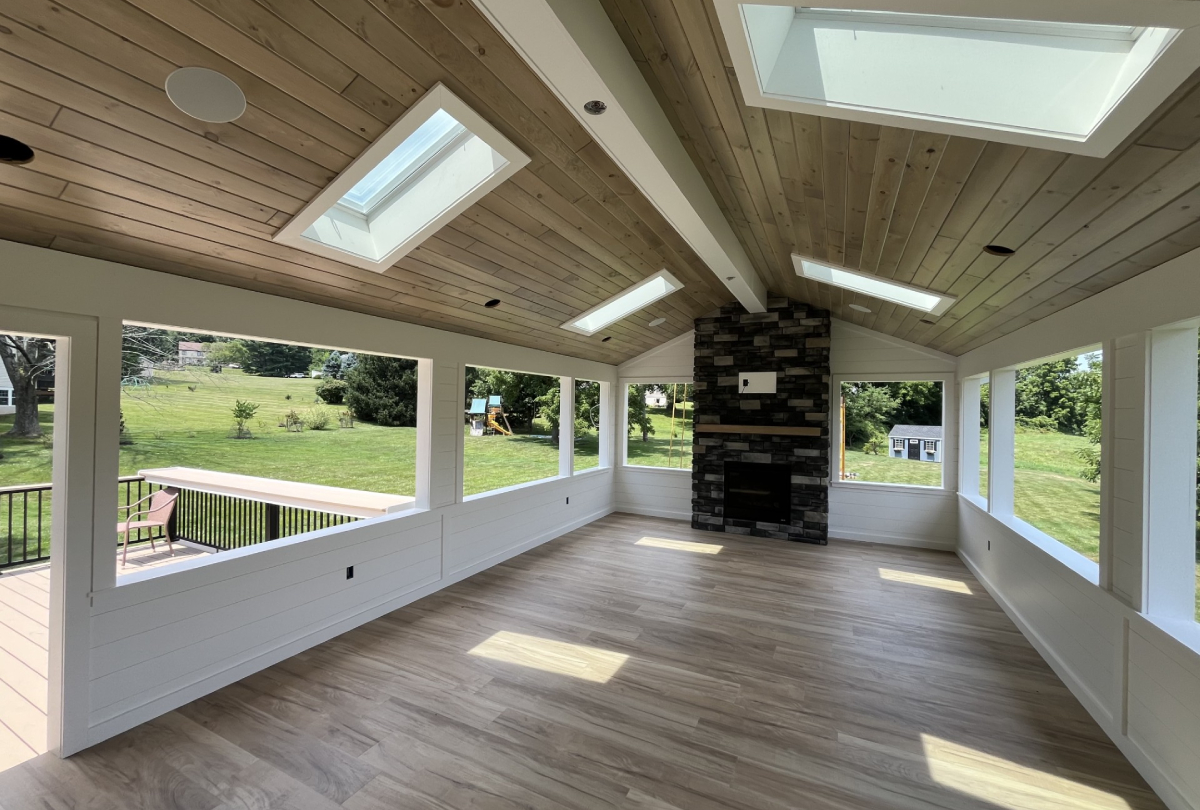 sunroom with wood paneling ceiling 