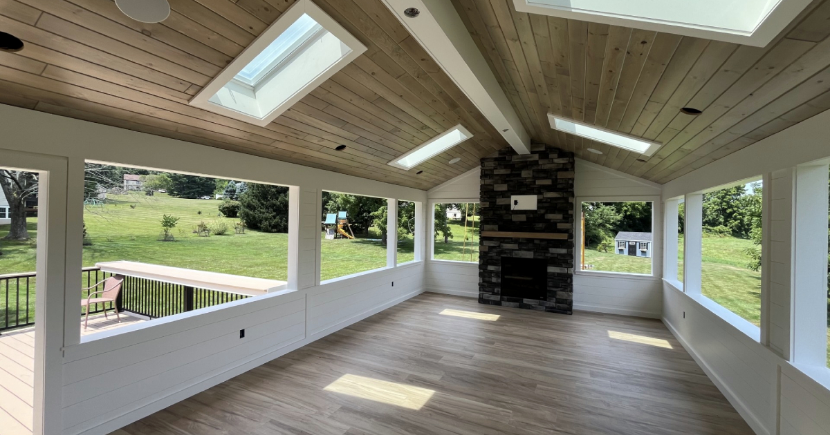 modern sunroom with wood ceiling
