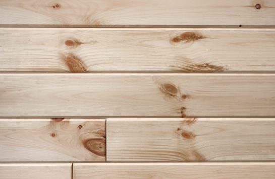 closeup clear prefinished wood paneling boards