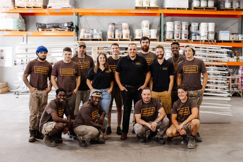 prestige wood products team in warehouse